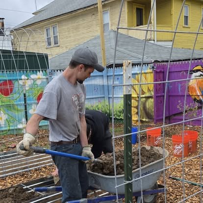 A volunteer building garden infrastructure