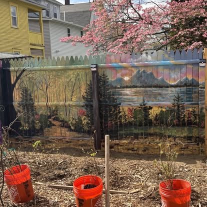 Landscape mural painted on a garden fence