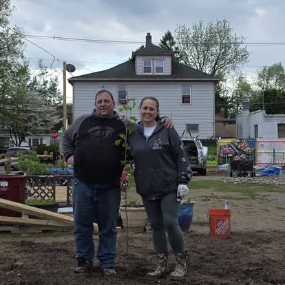 Volunteers standing in the garden area