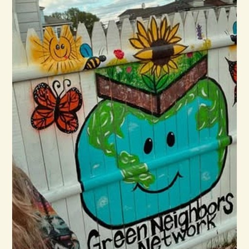 Green Neighbors Network mural logo painted on the fence